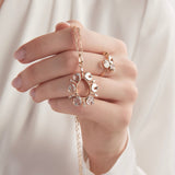 Model holding diamond slice pendant and wearing diamond slice ring