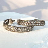 SIDE VIEW OF LARGE DIAMOND SLICE HOOP EARRINGS