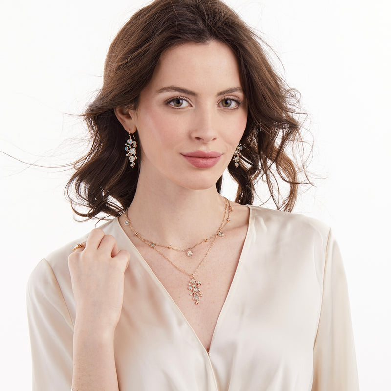 Model wearing diamond slice and opal necklace by LORIANN jewelry