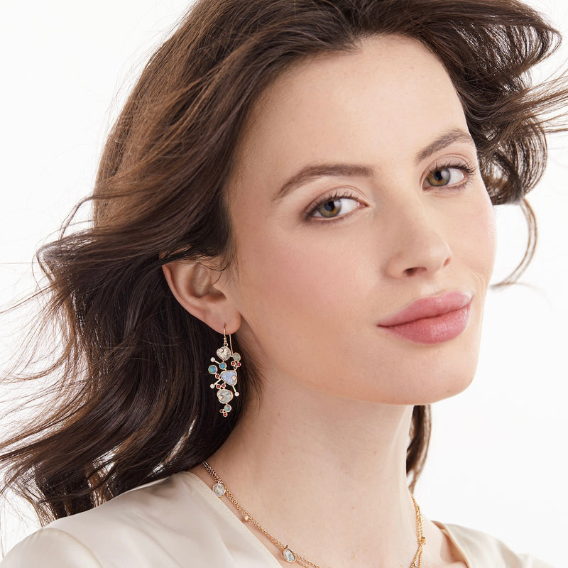 Model wearing diamond slice and opal earrings by LORIANN jewelry