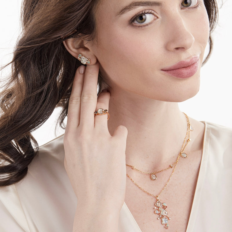 Model wearing diamond slice jewelry with opals and orange sapphires by LORIANN