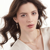 Model wearing 14K gold and diamond slice jewelry by LORIANN