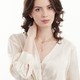 Model wearing linear gold and diamond slice necklace