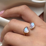 BYPASS RING WITH MOONSTONES AND 14K GOLD