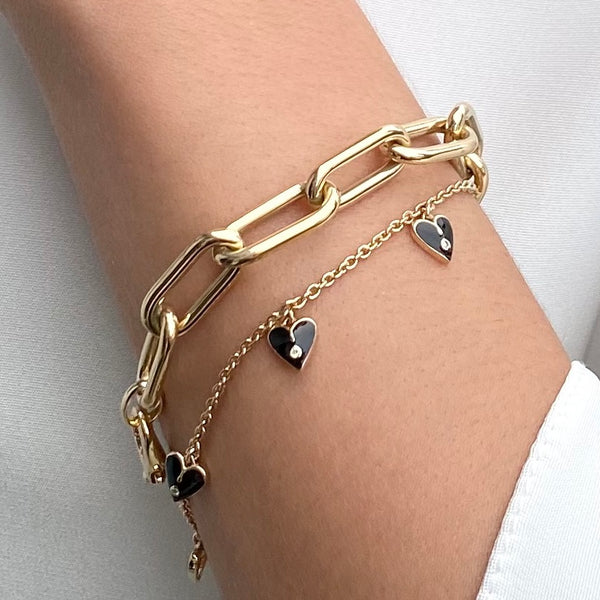 Black enamel and diamond heart charm bracelet