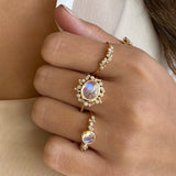 Moonstone and diamond rings worn by model