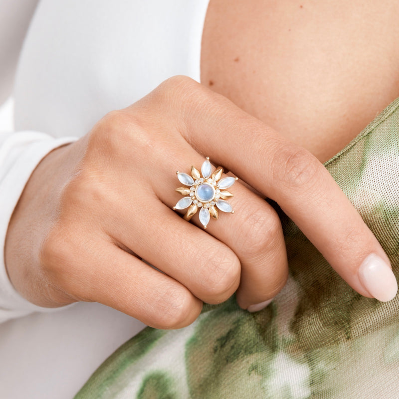 Model wearing moonstone and gold leaf statement ring