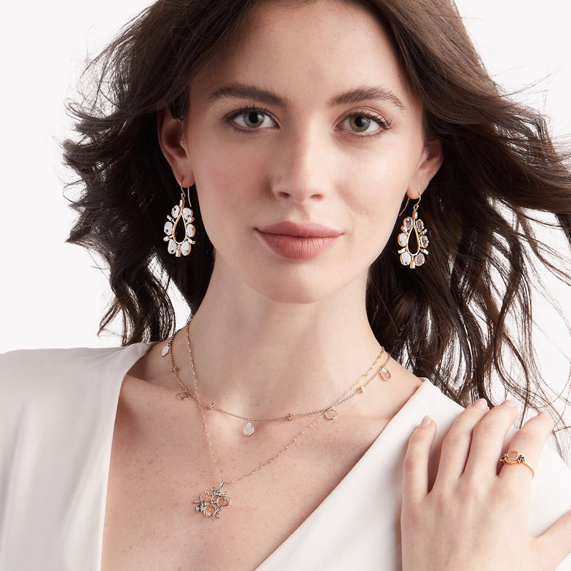 Model wearing award winning diamond slice earrings and diamond slice jewelry