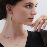 Model wearing enamel and gold dome ring