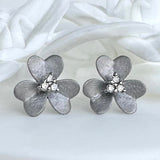 FLOWER STUD EARRINGS WITH DIAMONDS AND RHODIUM SILVER