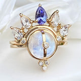MOONSTONE RING SET WITH WHITE TOPAZ AND TANZANITE ARC BAND